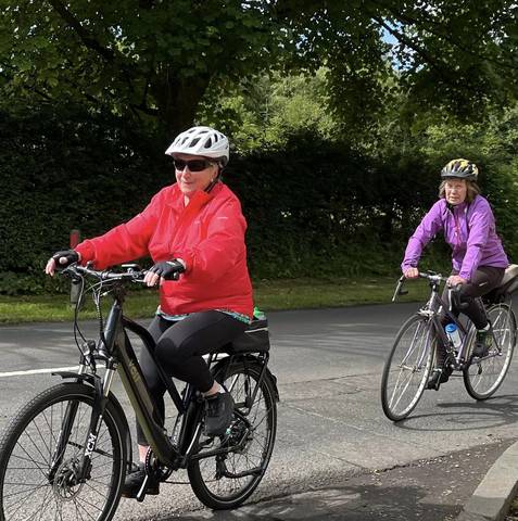 Two cyclists on minor road.