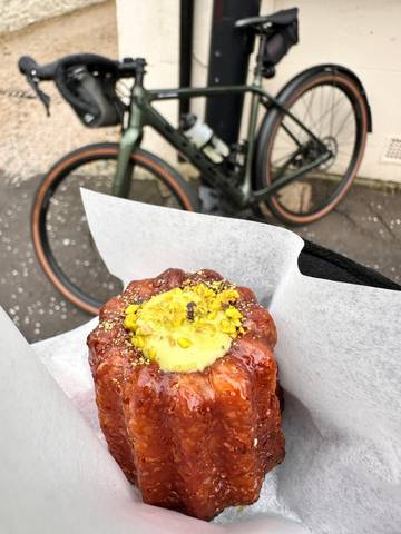 Pastry close up with bike in background.