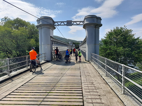 Cyclists inspecting a viaduct